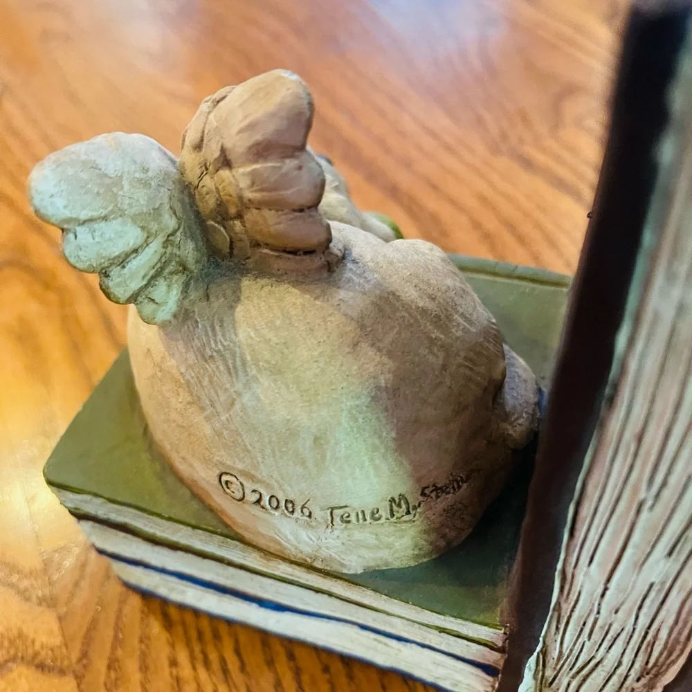 A pair of  stone bunny inc.2006 Telle M. Stein, Dog angel with ball bookends